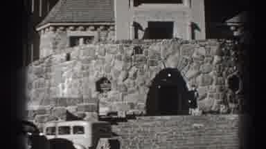 Bonneville Dam Oregon (1938): Two Cars Parked In Front Of Large Stone Building
