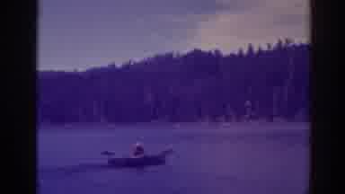 Bucks Lake California (1938): Man Rowing Across The Lake In The Wooded Mountains