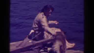 Bucks Lake California (1938): Woman Plays With Hungry Dog Next To The Water On A