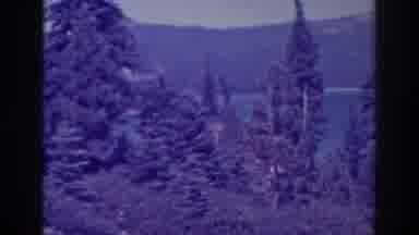 Bucks Lake California (1938): A Slow Pan Of A Mountain Scene With A Lake And Pines