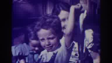 El Dorado City California (1938): Small Boy Hold Fish In Front Of Woman Wearing