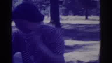 El Dorado City California (1938): Woman Wearing White Apron Hangs Laundry On