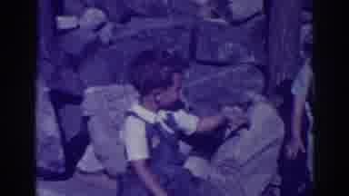 El Dorado City California (1938): Mom Taking Care Of Her Kids While They Play