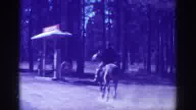 El Dorado City California (1938): Man Riding A Horse In Haste On Deserted Sand