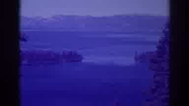 Emerald Bay California (1938): View Of Mountains Blue Lake Water And Brown Object