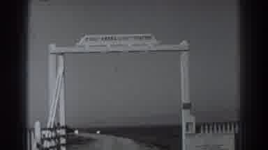 Fort Ross California (1938): We See A Sign That Is High Up Then A Building Both
