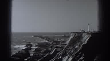Fort Ross California (1938): A Lighthouse On Top Of A Cliff Overlooking The Ocean