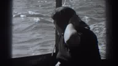 Fort Ross California (1938): Woman On Boat In Water Wearing Scarf