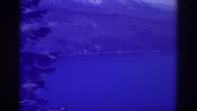 Lake Tahoe California (1938): Large Blue Lake Surrounded By Mountains And Trees