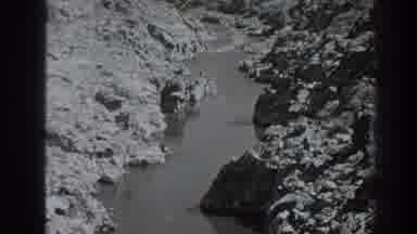 Oroville California (1938): A Gray Shot Of Water And Some Old Dry Mountains Are