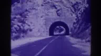 Oroville California (1938): Car Driving On Road About To Pass Through A Tunnel