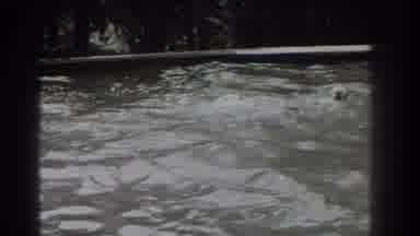 Southhampton New York (1937): Woman Wearing White Swim cap Swims In Pool On A