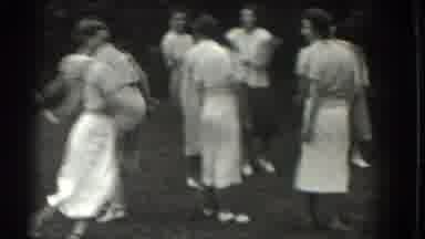 Southhampton New York (1937): The Group Of Women Stand Around As One Playfully