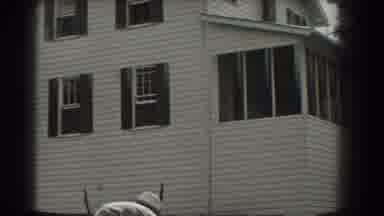 Southhampton New York (1937): View Of A White House With Black Window Trim On A