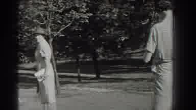 Southhampton New York (1937): View Of Women Walking Past Trees In Park On A Bright