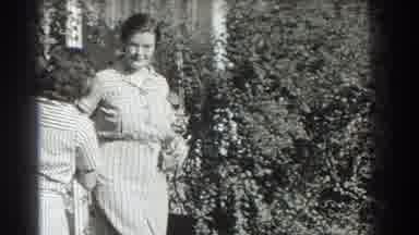 Southhampton New York (1937): Two Women Wearing White Dresses Walk Past Camera And