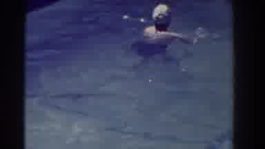 Southhampton New York (1937): Woman Wearing White Swim cap Swims In Pool On A
