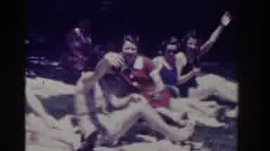 Southhampton New York (1937): Four Women Sitting On White Towels Wave To Camera On