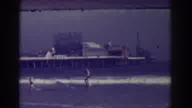 Atlantic City New Jersey (1938): Two People Wearing Black Shorts Walking Away From