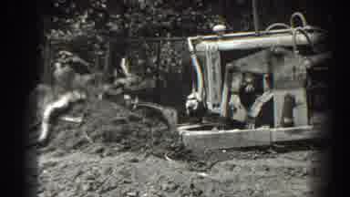 Cumberland Maryland (1938): Old Farmer Driving Old Tractor Moving Dirt With Tree