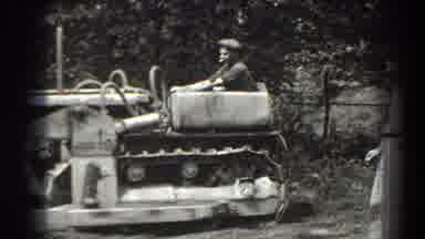 Cumberland Maryland (1938): Man Operating Bulldozer Removing Tree Stumps With