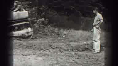 Cumberland Maryland (1938): Man Watching A Machine Fix The Road