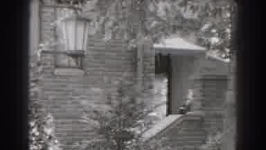 Cumberland Maryland (1938): Brick House Seen From Outside And Woman Walking From