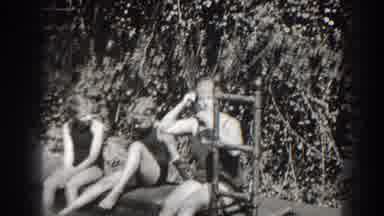 Cumberland Maryland (1938): Three People Sitting On Edge Of Pool On A Bright Sunny