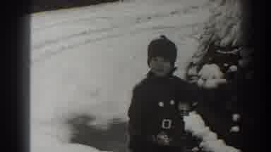 Martinsburg West Virginia (1938): A Child Smiles Outside In The Winter By Tire