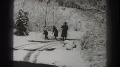 Martinsburg West Virginia (1938): Two People Throwing Snowballs While Third Person