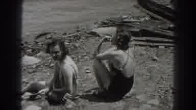 New Jersey (1938): Old Film Of Two Women On The Beach And A Fire Next To It
