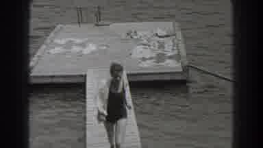 New Jersey (1938): Woman In A One Piece Bathing Suit Running Across A Pier