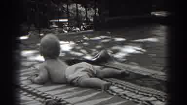 New Jersey (1938): Baby Crawling On Stomach Woven Rug Outdoors Turns To Look At
