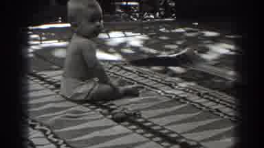 New Jersey (1938): Baby Wearing White Shorts Sits On Blanket On A Clear Day
