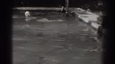New Jersey (1938): A Woman Wearing A One-Piece Swimming Suit And Swimming Cap