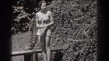 New Jersey (1938): Woman In Bathing Suit Holding Her Swimming Cap And Smiling At