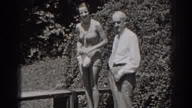 New Jersey (1938): Woman Wearing Swimsuit Holding Cap And Man Wearing Dress Shirt