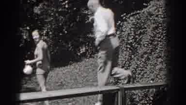 New Jersey (1938): Old Man Jumping Carefully Off A Platform Whilst A Lady Watches
