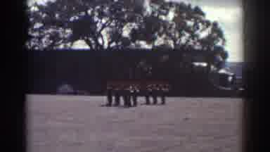 Quebec (1938): Marching Band Standing In Formation In Open Grass Field