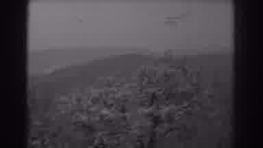 West Virginia (1938): A Distant Mountain Scenery With Trees Blooming On A Cloudy