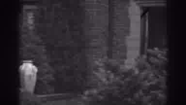 Winchester Maryland (1938): View Of Stone Building Entrance And Bushes On A Cloudy