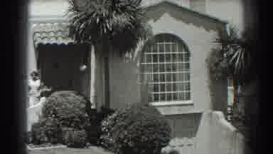 San Francisco California (1939): Film Of A Woman Standing At Front Of House And