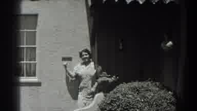 San Francisco California (1939): A Woman Talking To Someone Afar From A Building
