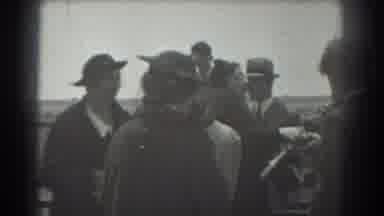 San Francisco California (1939): Woman Handling Package To Man Holding A Newspaper
