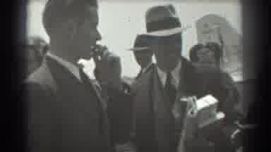 San Francisco California (1939): Man Carrying Newspaper And Packages Shaking Hands