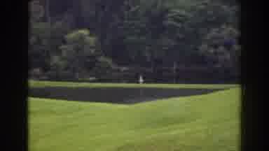 Florida (1941): A Person Wearing White Clothes Walks In A Vast Green Field With