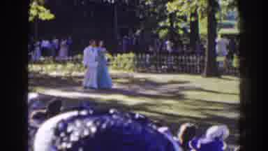 Florida (1941): Couple In Formal Dress Walks The Garden Aisle At Daytime