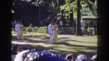 Florida (1941): Couples In Formal Dress Walk As An Orchestra Plays As Crowd
