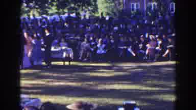Florida (1941): People Walking Across Green Grass On A Clear Sunny Day