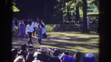 Florida (1941): Four Period-Dressed People Walk Through Open Field For Crowd